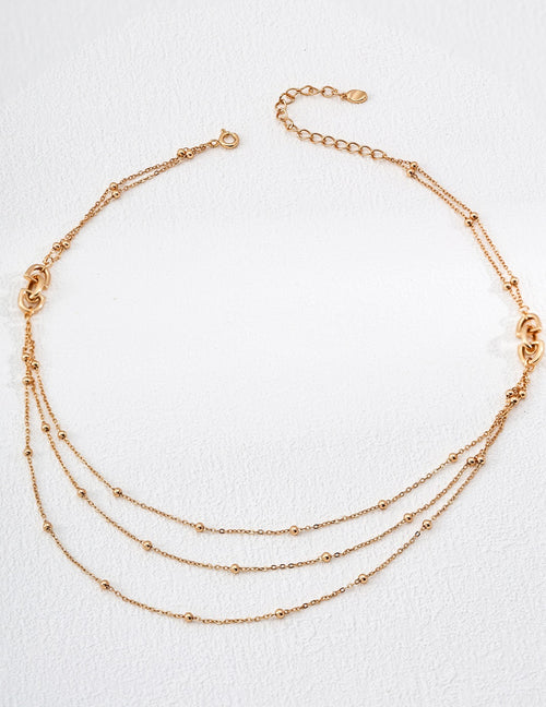 18K gold plated 925 silver multi-layer beaded chain necklace on white background