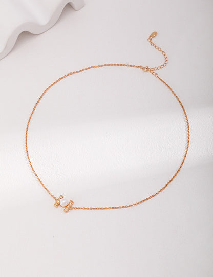 Minimalist 18K gold plated 925 silver necklace with natural freshwater pearl pendant on white background