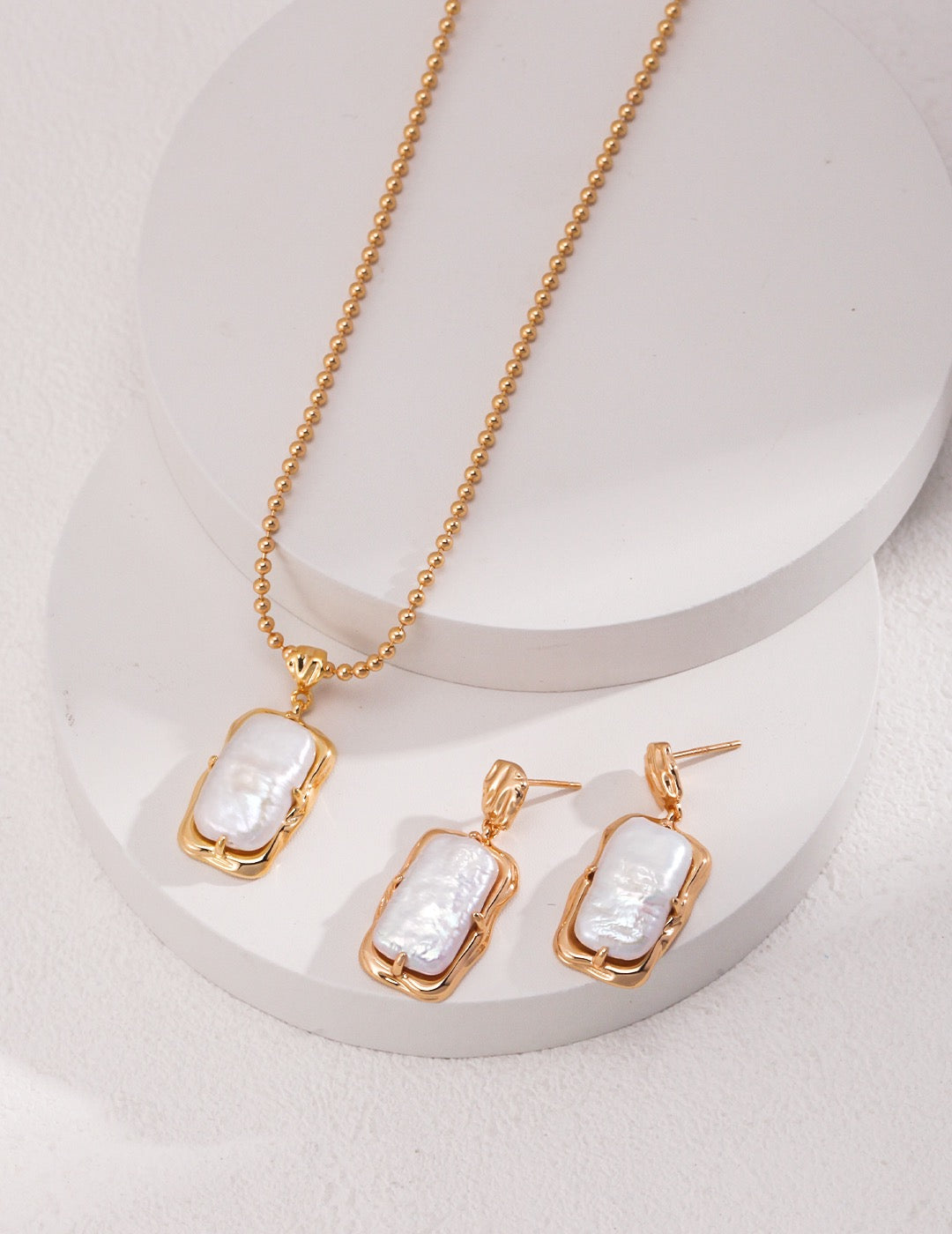 18K gold plated 925 silver natural baroque pearl necklace and earrings set on white display