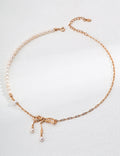 Bow design pearl necklace with 18K gold plated 925 silver chain and natural freshwater pearls on a white background