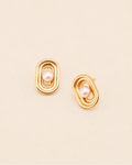 Elara Pearl Stud Earrings featuring a modern geometric frame and luminous pearl centerpiece in polished gold finish.