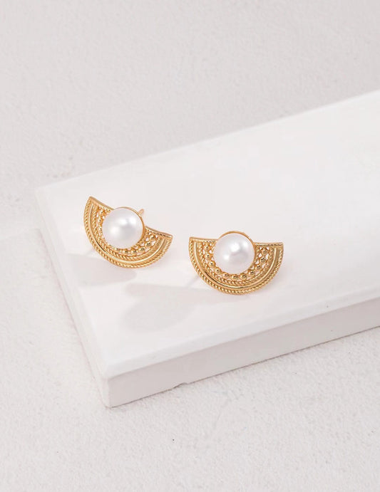 Elegant 18K gold-plated 925 silver half-moon stud earrings with natural freshwater pearls and vintage filigree design on a white background.