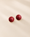 Glossy red enamel stud earrings crafted from S925 sterling silver with thick 18K gold plating, featuring a minimalist round dome design on a soft ivory background.