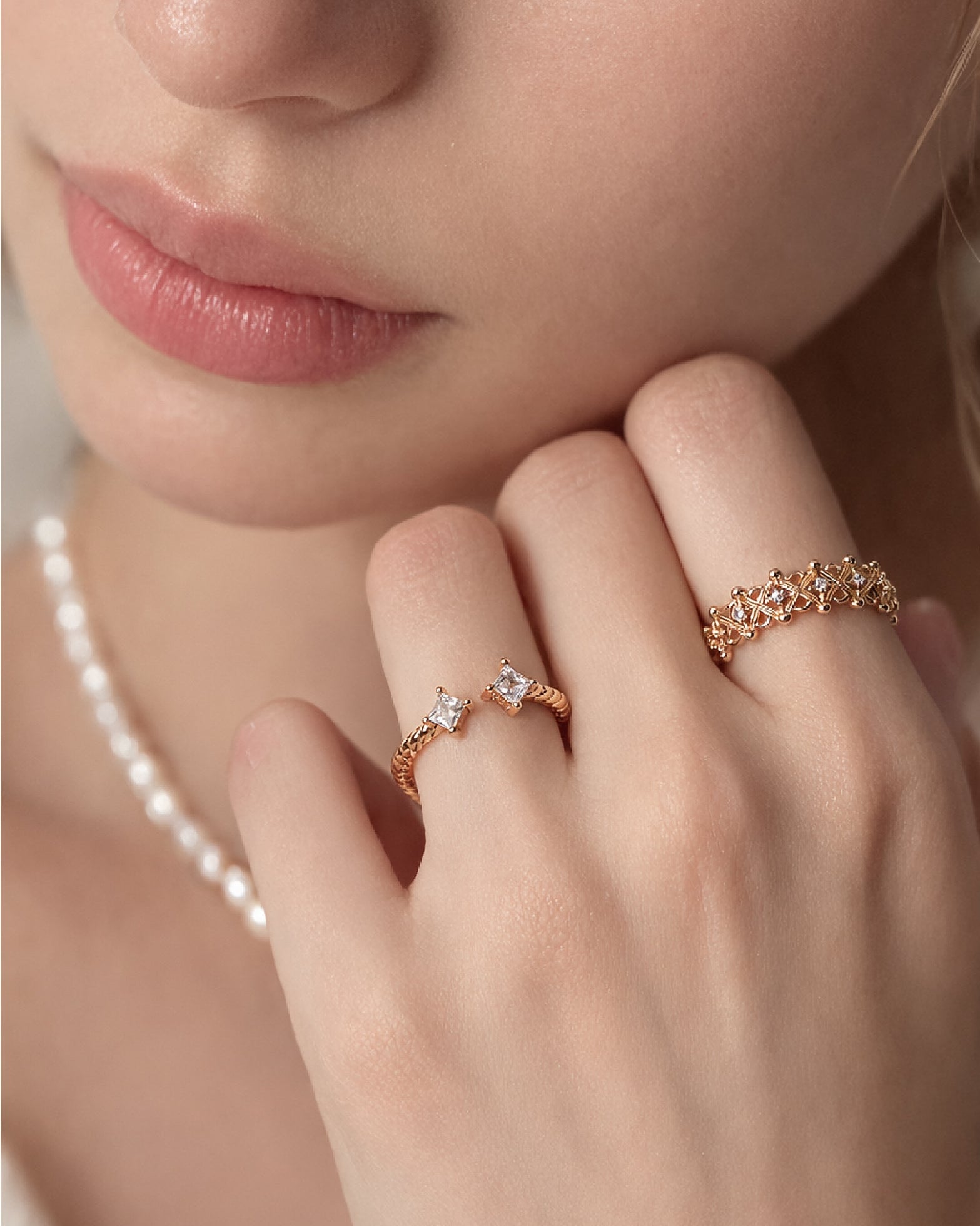 Woman wearing the Celeste Crown Ring, an adjustable sterling silver ring with cubic zirconia stones.