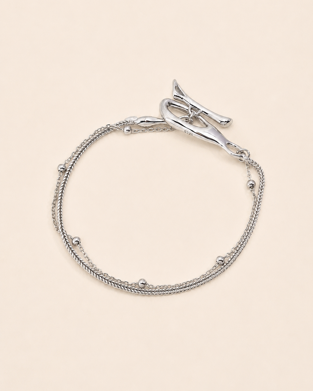 Silver Entwine Branch bracelet featuring an organic branch-inspired clasp and delicate layered chains.