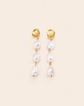 Elegant gold drop earrings featuring three freshwater pearls in a cascading design