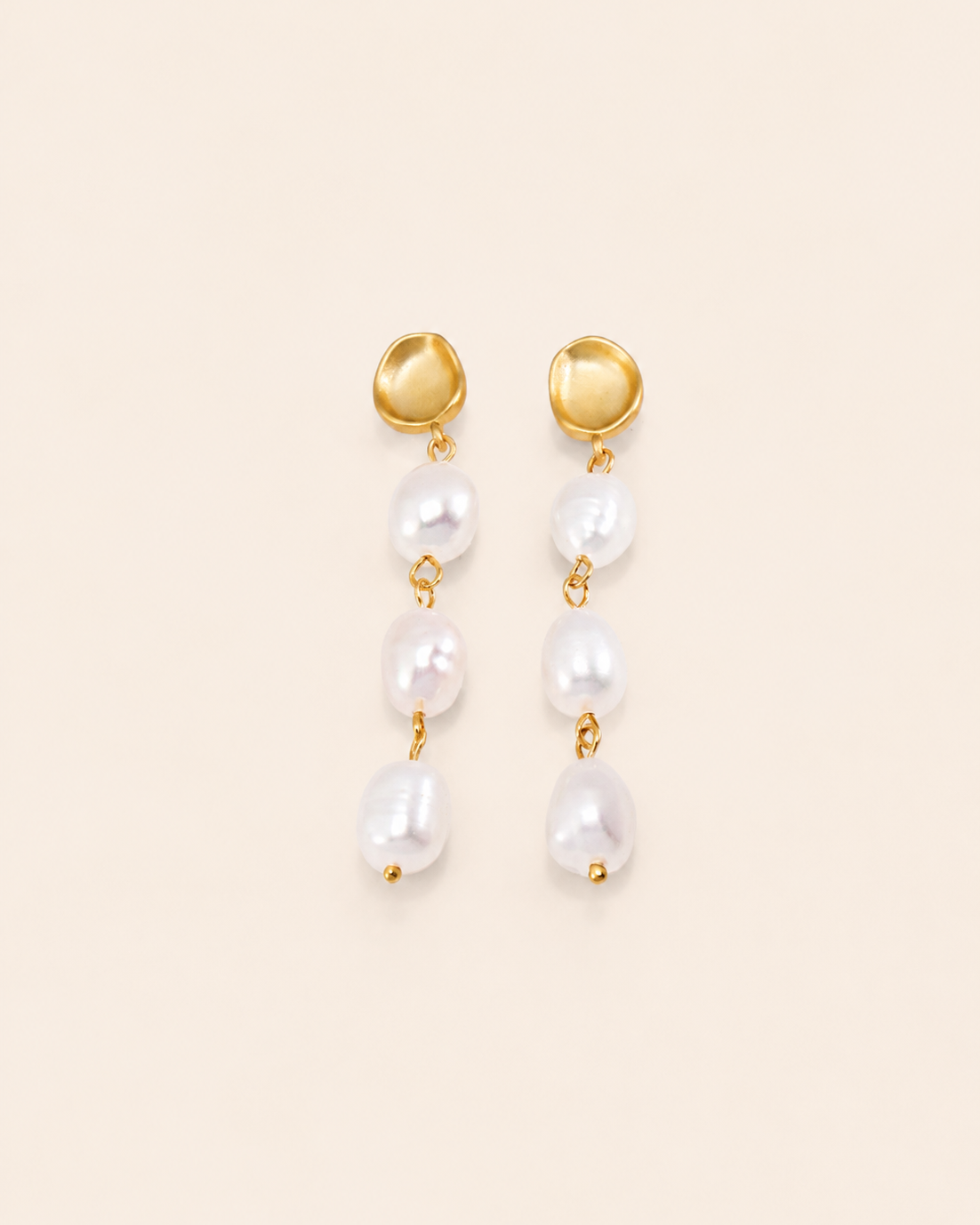 Elegant gold drop earrings featuring three freshwater pearls in a cascading design