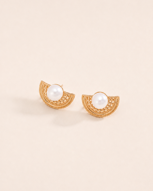 Gold vintage fan stud earrings with pearl centerpiece on a soft ivory background