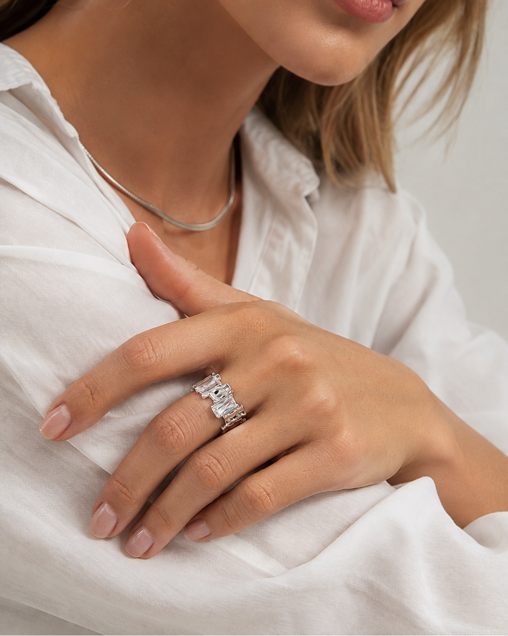 Close-up of the Lumière Duo adjustable ring styled for an elegant everyday look.