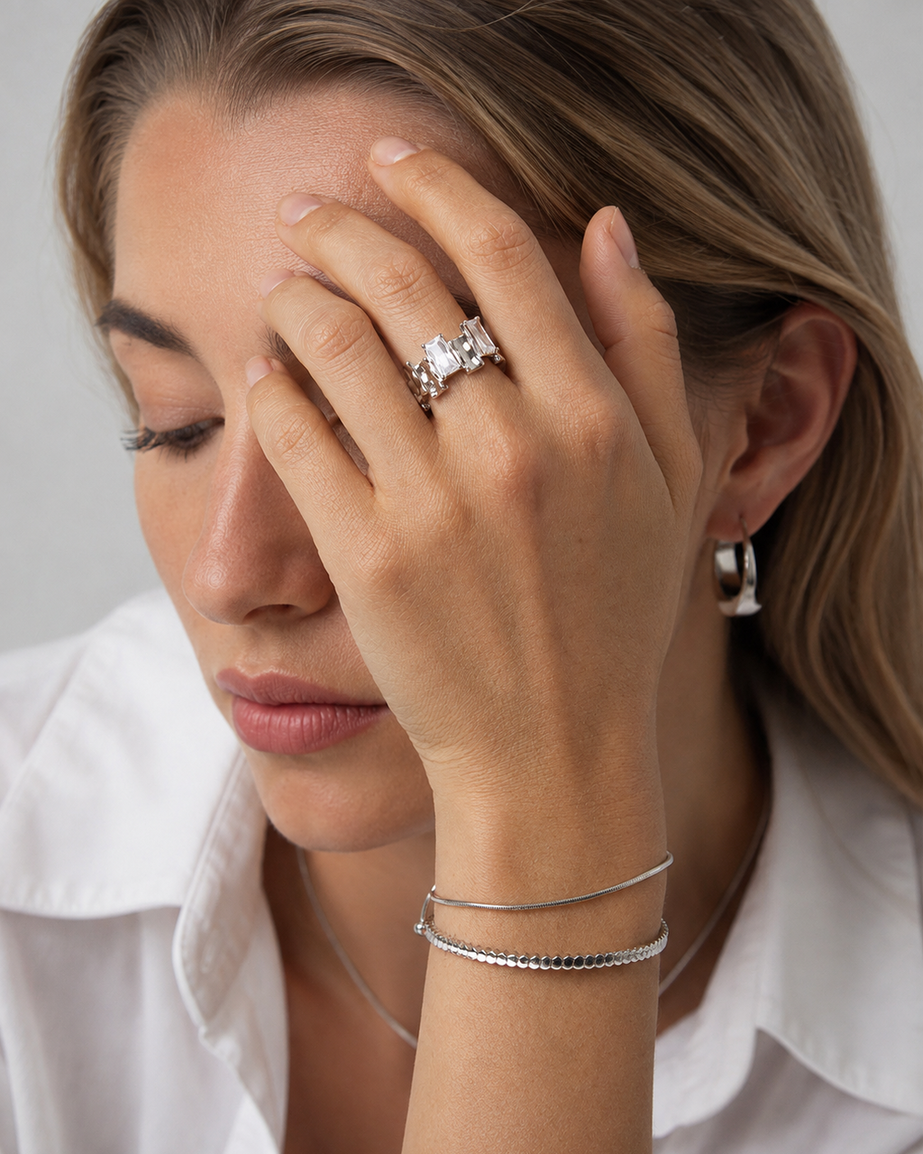 Model wearing the Lumière Duo sterling silver adjustable ring with baguette-cut cubic zirconia.