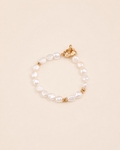 Luna Heart Pearl Bracelet in gold featuring natural freshwater pearls and a heart clasp.