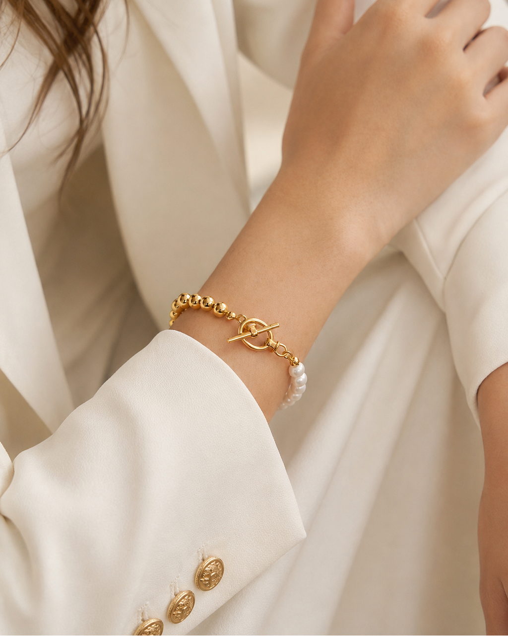 Close-up of the Luna Pearl T-Bar Bracelet highlighting the toggle clasp, thick 18K gold plated sterling silver beads, and natural freshwater pearls.