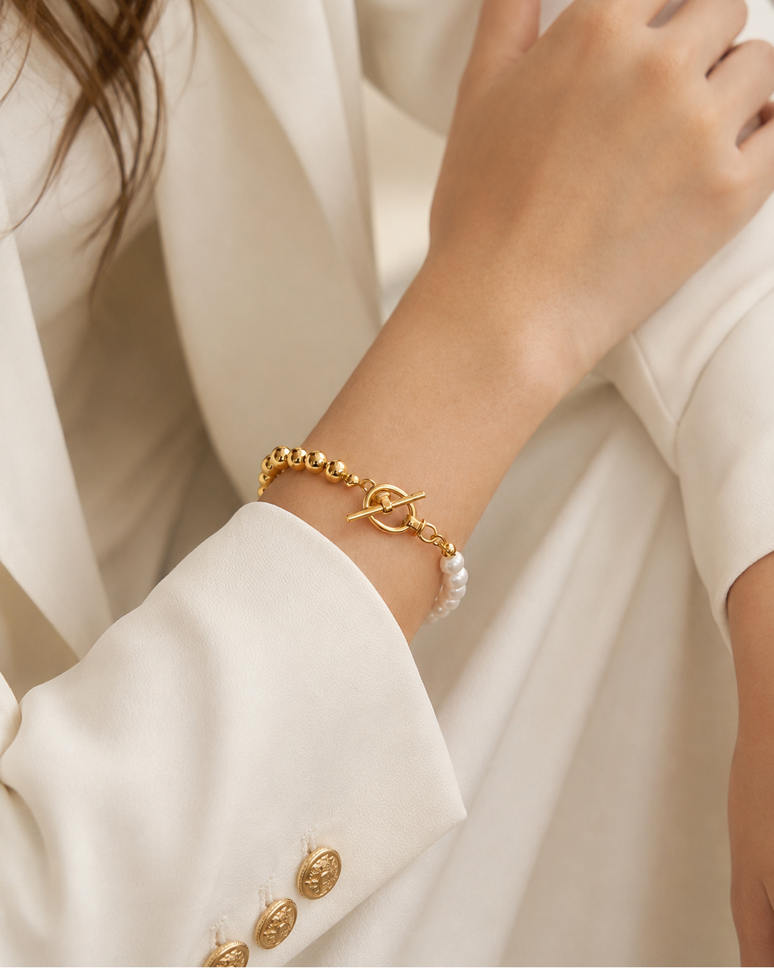 Close-up of the Luna Pearl T-Bar Bracelet highlighting the toggle clasp, thick 18K gold plated sterling silver beads, and natural freshwater pearls.