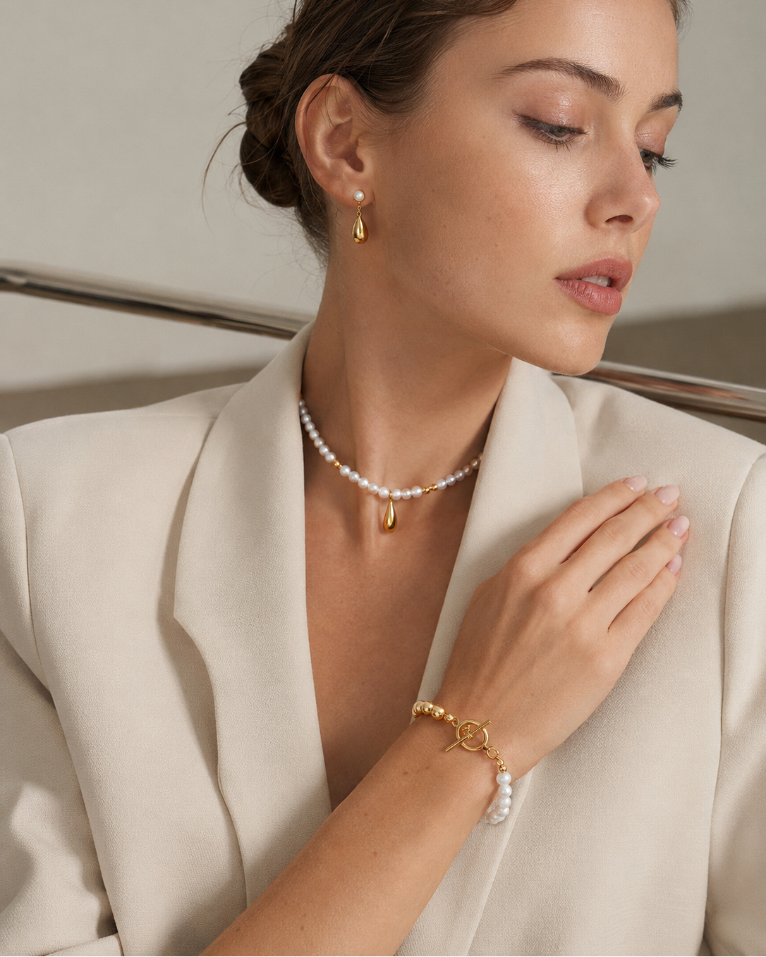 Model wearing the Luna Pearl T-Bar Bracelet crafted from thick 18K gold plated S925 sterling silver and natural freshwater pearls.