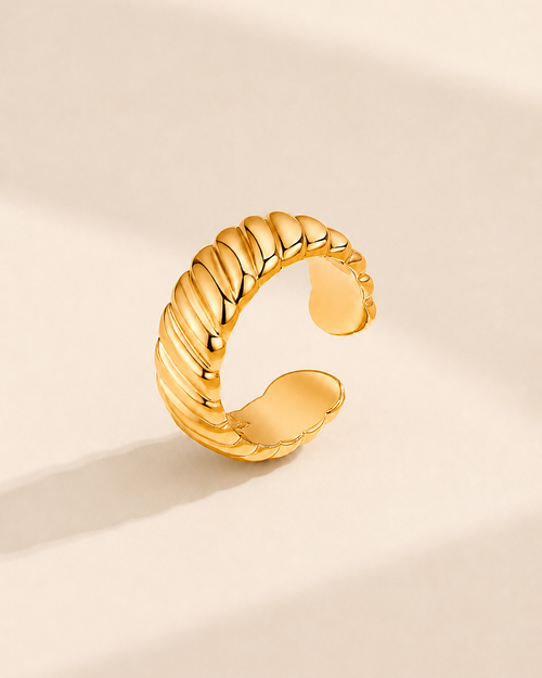 Adjustable rope texture ring crafted from S925 sterling silver with thick 18K gold plating on a soft ivory background.