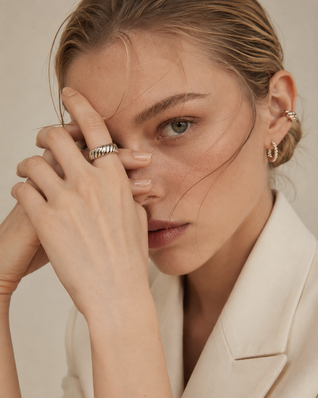 Close-up of a model wearing an adjustable rope texture ring in thick 18K white gold plated sterling silver.