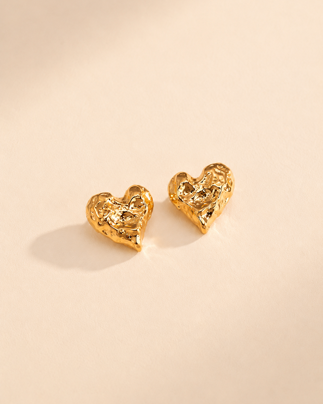 Melted Heart stud earrings in thick 18K gold plating, crafted from S925 sterling silver with an organic sculptural heart design.