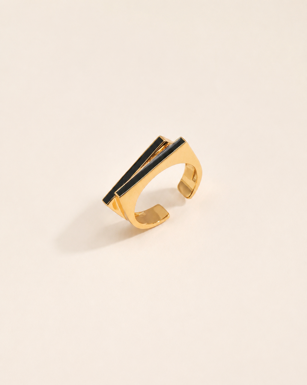 Noir Line Ring crafted in sterling silver with 18K gold plating and black enamel detailing, featuring a modern adjustable open-band design.