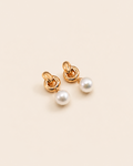Pair of NORA Pearl Earrings with gold knot detailing and luminous freshwater pearl drops.