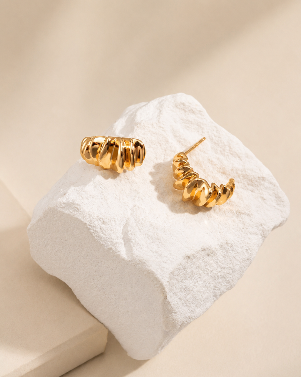 Gold Ripple Huggie Earrings in 925 sterling silver with thick 18K gold plating featuring a sculptural organic design.