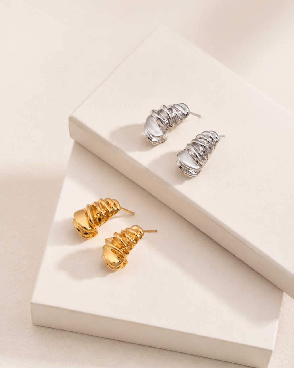 Ripple Huggie Earrings available in thick 18K gold plating and thick 18K white gold plating on 925 sterling silver.