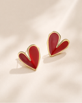 Red heart-shaped enamel stud earrings crafted in S925 sterling silver with 18K gold plating.