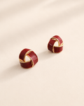 Scarlet Knot stud earrings in crimson enamel and 18K gold plated sterling silver with an elegant intertwined design.