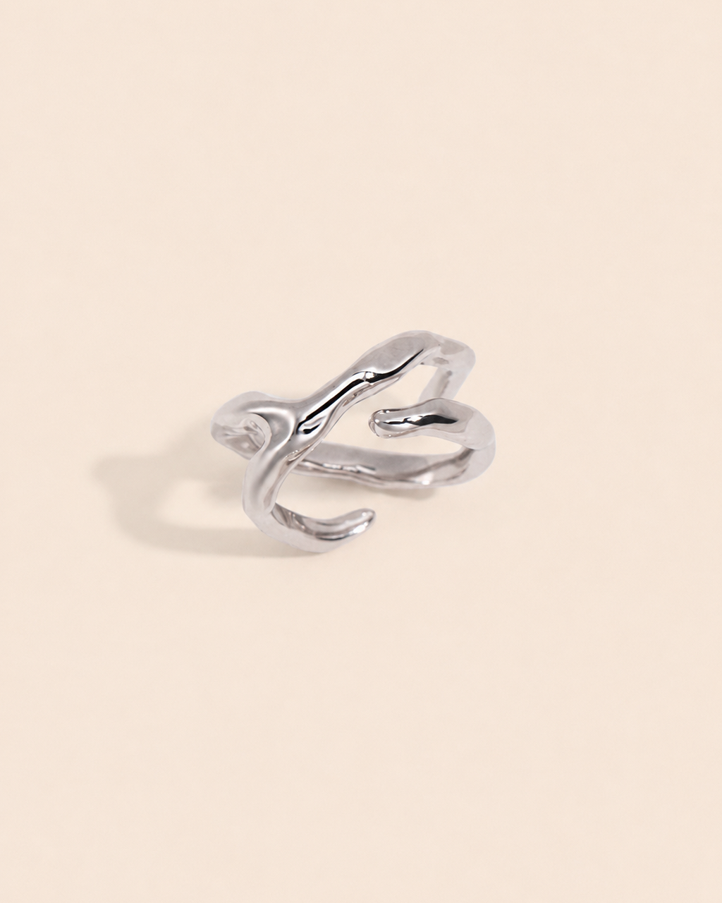 Sculpt Flow Ring in 18K white gold plated S925 sterling silver with a modern organic sculptural silhouette.