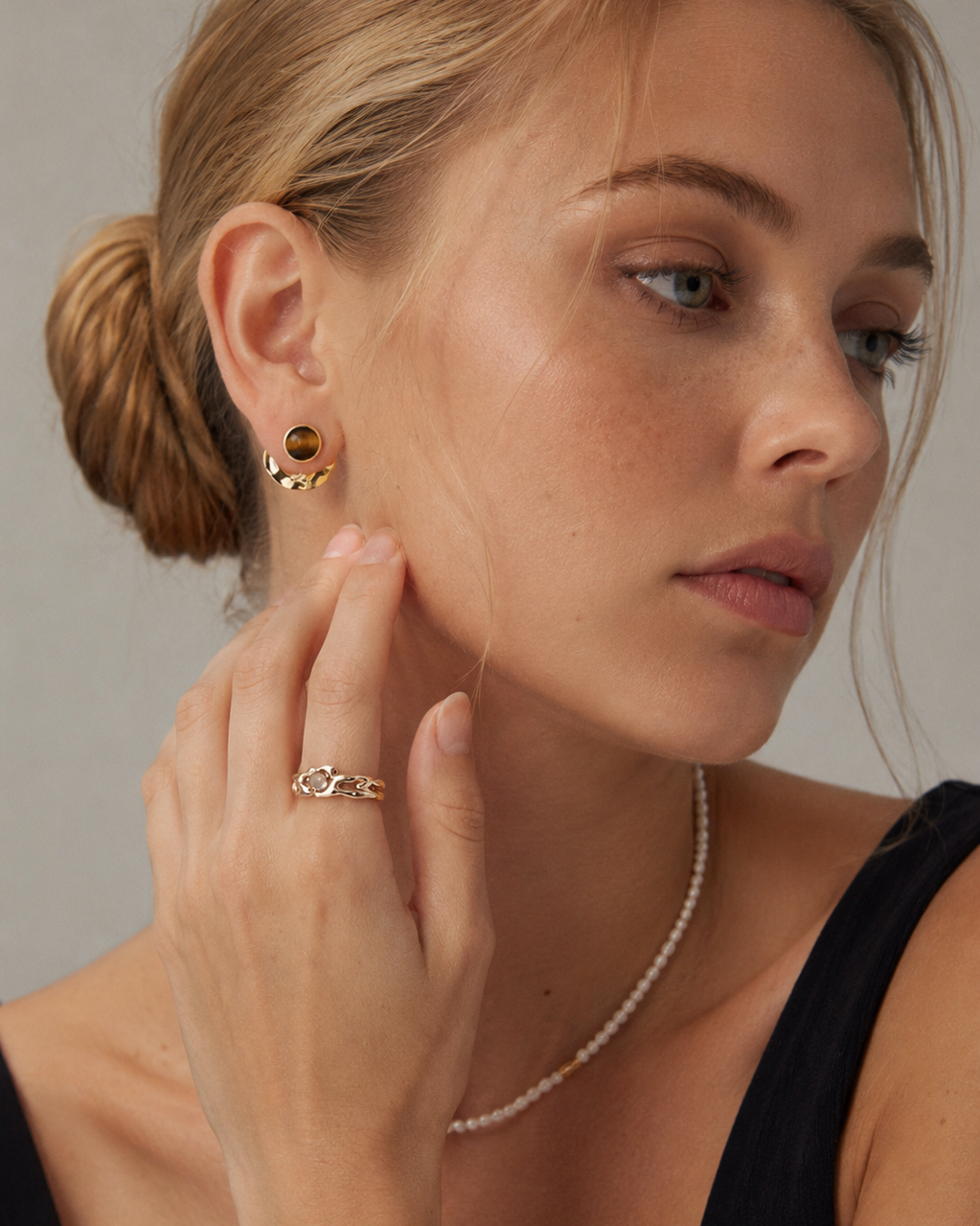 Model wearing convertible tiger eye earrings in thick 18K gold plated S925 sterling silver, showcasing a modern layered statement look.