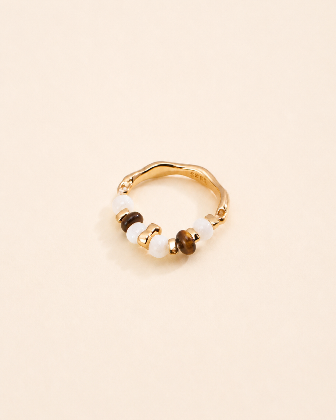 Tiger Eye and Mother of Pearl beaded ring in thick 18K gold plated S925 sterling silver on a soft cream background.