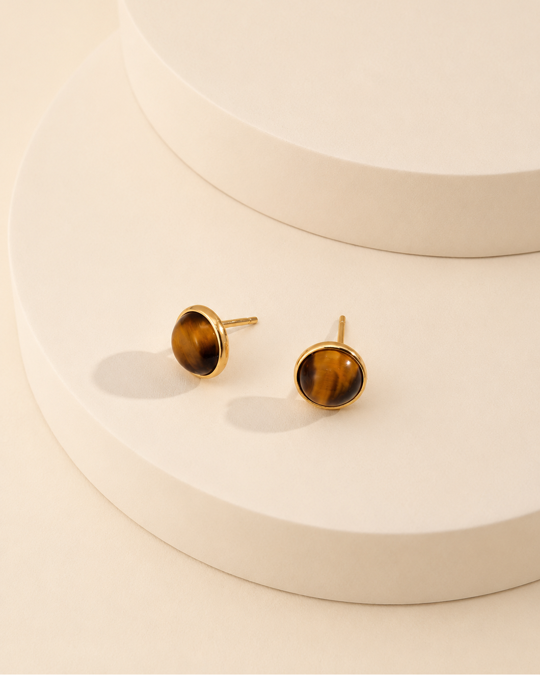 Natural tiger eye stud earrings in S925 sterling silver with thick 18K gold plating, designed to be worn alone or paired with detachable jackets.