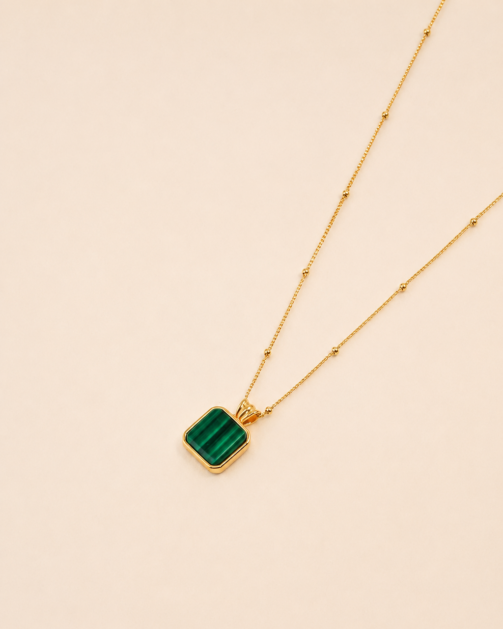 Natural malachite pendant necklace in 18K gold plated sterling silver with a square green gemstone charm and adjustable chain.