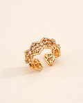 Vintage Lace adjustable ring in S925 sterling silver with thick 18K gold plating and cubic zirconia, featuring an intricate filigree openwork design on a soft beige background.